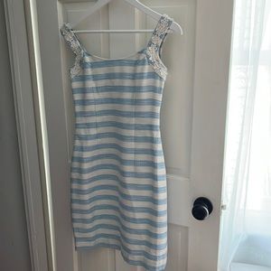 Light blue and white dress with silver threading and daisy appliqué.